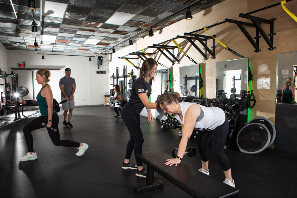 A semi-private strength training session led by a certified personal trainer.